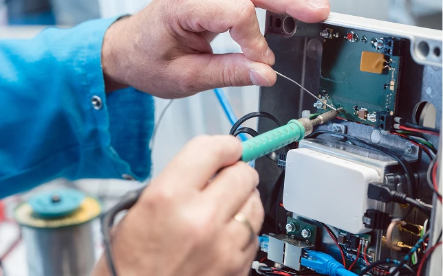 a component on a circuit board within an open electronic device.