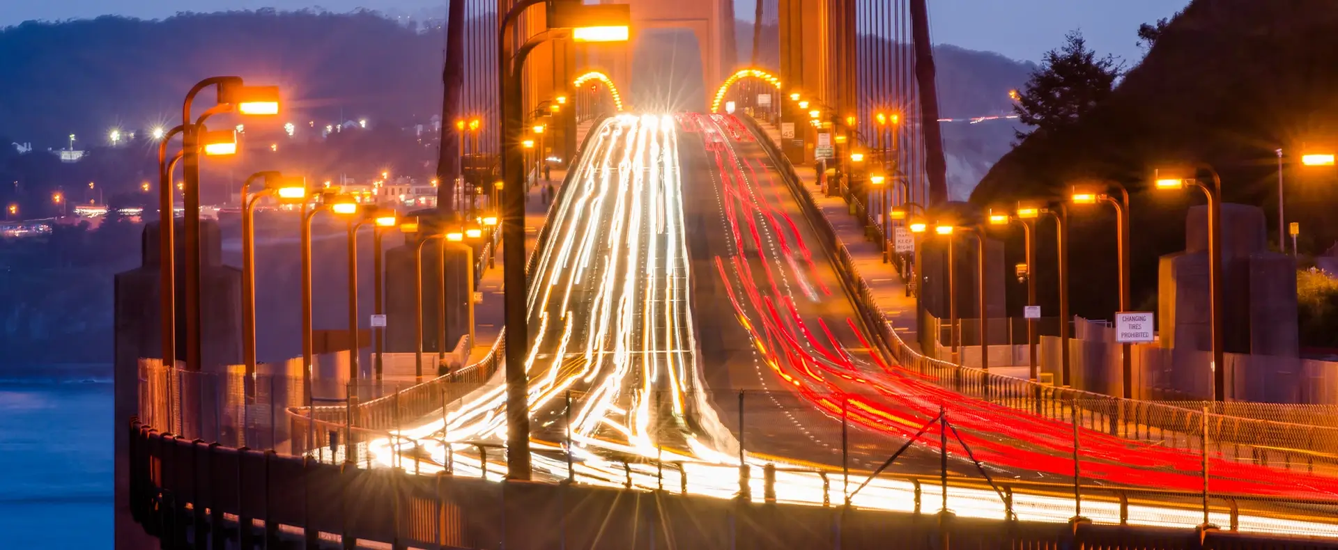 Long exposure light trails of traffic crossing the Golden Gate Bridge at night