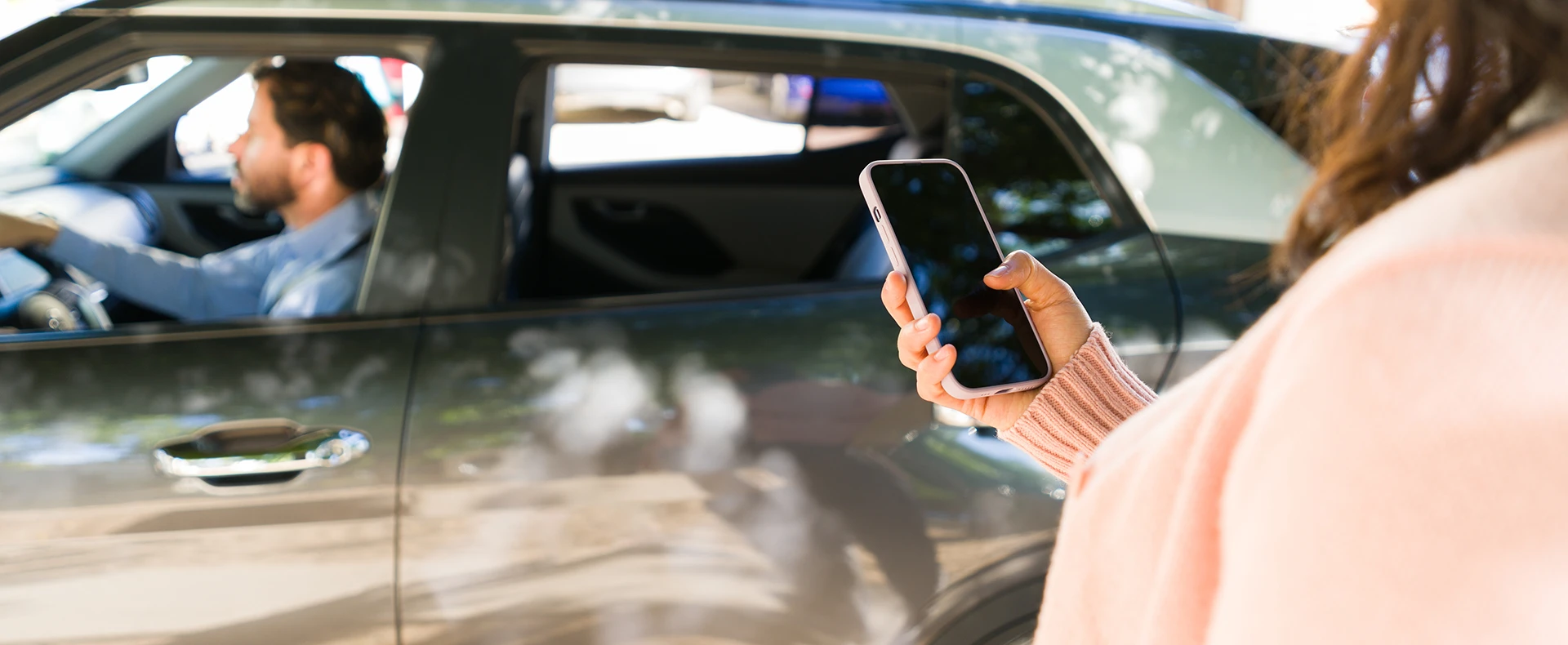 Passenger using a mobile app to hail or track a rideshare vehicle representing a Uber or Lyft accident claim