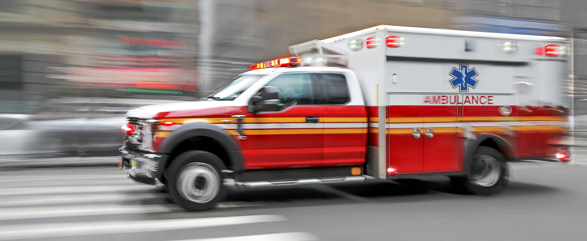 Ambulance responding to a serious injury emergency on a city street